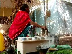 Incense burning while Ethiopian woman roasts coffee grains Stock Footage