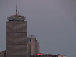 Full Moon rises over Boston Downtown at dusk. TL day to night. Zoom in. Stock Footage