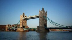 Golden light shines on the Tower Bridge in London. Stock Footage