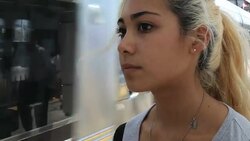 Teenage girl waits nervously for train Stock Footage