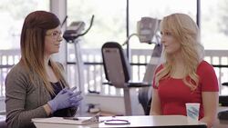 Speech therapist working with a young adult female patient Stock Footage