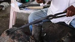 Blacksmith working on metal Stock Footage