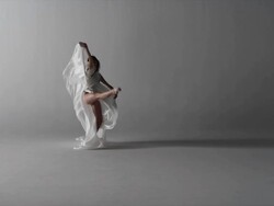 woman with silk draped around her performing Stock Footage