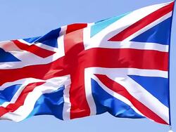 MS SLO MO Shot of British Flag Waving in Wind / Caen, Normandy, France Stock Footage