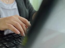 Businesswoman Typing at Keyboard,Dolly shot Stock Footage