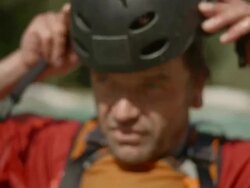 HD: Whitewater Kayaker Putting On The Helmet Stock Footage