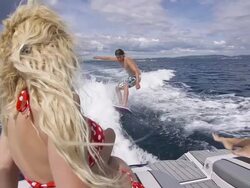 Surfing behind boat Stock Footage