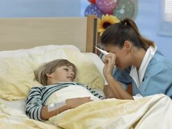 HD DOLLY: Nurse Taking A Child's Temperature Stock Footage