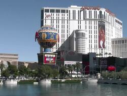 View of Planet Hollywood over lake at Bellagio Resort in Las Vegas Stock Footage