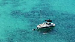 Aerial view of two women swimming in the sea Stock Footage