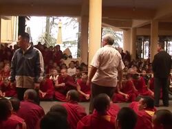  MS PAN Monks sitting in line AUDIO / Dharamsala, Himachal Pradesh, India Stock Footage