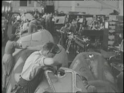 Factory workers assemble B24 Liberators in a Ford factory. News Clip