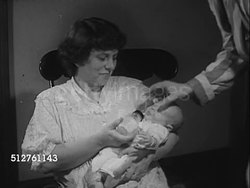 1953: NEWBORN: TWO AM: 'Grace Hobbs' feeding newborn infant baby bottle, both trying to encourage baby take more formula.  [SOT Dr. Spock saying baby knows when to stop, making him take more may make him lose positive attitude, defensive]... Instructional Video