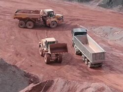 WS Crane putting mud in other truchk in  quarry / Taben-Rodt, Hesse, Germany  Stock Footage