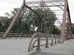 WS Two young girls running on bridge / Minneapolis, Minnesota, United States Stock Footage