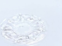 Droplet falling into water against white background, Slow motion Stock Footage