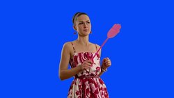 young beautiful woman with swatter  on a blue screen . Stock Footage