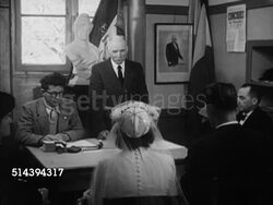1950: BEAULIEU: DORDOGNE VALLEY: VS Mayor in office instructing couple before marriage, groom & bride listening, bride standing up, signing registration paper for marriage. France, country, rural, register, signature Instructional Video