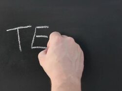 Writing 'Teach' on the school blackboard Stock Footage
