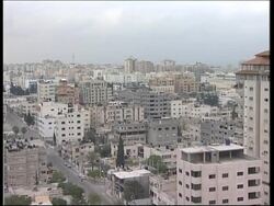 Gaza skyline with audio of gunfire in streets News Clip