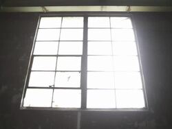 MS Boards being removed from damaged old window and light breaking through shot from interior / Rutland, Vermont, United States    Stock Footage