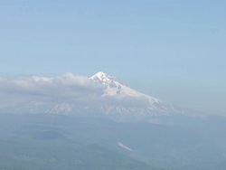 Snowy peak of Mount Hood partially obscured by clouds Stock Footage