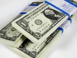 CU SLO MO Shot of Wads of 1 US Dollar Banknotes falling against White Background / Calvados, Normandy, France Stock Footage