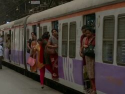 MS ZO Train arriving and passengers walking away on Church Gate Station / Mumbai, Maharashtra, India Stock Footage