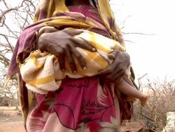 Pregnant woman holding child Stock Footage