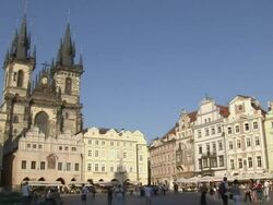 Wide Shot static-Pedestrians walk through a town square in Prague. / Prague, Czech Republic Stock Footage