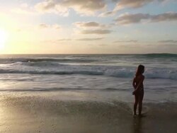 MS View of Girl standing in water of beach near Santa Maria / Santa Maria, Sal, Cape Verde Stock Footage