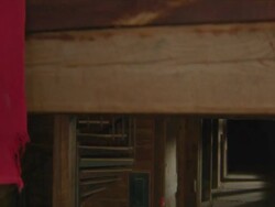 dolly jib arm shot of two dancers in wooden barn with American flags Stock Footage