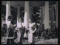 1948: THE GREENBRIER LUXURY RESORT:  VS Iconic white-columned springhouse of sulphur (sulfur) water springs at The Greenbrier, statue above springhouse. VS Group of female guests standing outside drinking, couple getting drinks from bartender, bar. Instructional Video