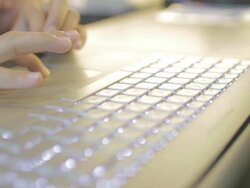 woman Typing at Keyboard,Dolly shot Stock Footage