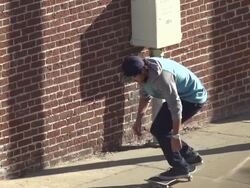 A young man skateboarding on the sidewalk.  - Slow Motion - filmed at 240 fps Stock Footage