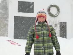 MS TU ZO Boy playing with snow during snowstorm  / Yarmouth, Maine, USA Stock Footage