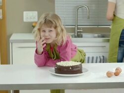 HD DOLLY: Adorable Girl Tasting A Cake Stock Footage