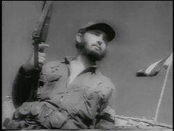 B/W 1959 CANTED low angle Fidel Castro in military uniform holding gun outdoors / Cuba / newsreel Stock Footage