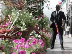 MS Young man dressed up in black suit and dancing on street / Minneapolis, Minnesota, United States Stock Footage