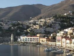 Symi, Greece. Timelapse of sun rising in harbour Stock Footage