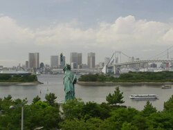 Statue of Liberty in Odaiba with Rainbow Bridge  Stock Footage