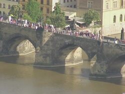 WS AERIAL Shot of pedestrians walking on bridge / Prague, Czech Republic Stock Footage
