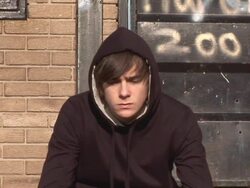 Bored Youth / Hoody Staring at camera with Graffiti Stock Footage