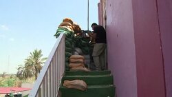 VOICED : Iraqi neighbourhood holds out against jihadists News Clip