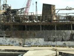 Damage in port area of Kesennuma City, Japan filmed on 1 April 2011, 3 weeks after a tsunami which was caused by magnitude 9 Tohoku earthquake off north east Japan / AUDIO Stock Footage