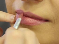 Unrecognizable make up artist doing make up model Stock Footage