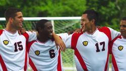 A team of soccer players sway in a line with their arms over one another's shoulders. Stock Footage