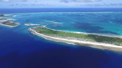 Pan right over entire Kanton Atoll Stock Footage