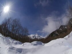 T/L wide angle shot of clouds passing over snowy field, Kamikochi, Japan Stock Footage