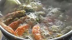 Slow motion: Cooking of spicy seafood soup hot pot Stock Footage